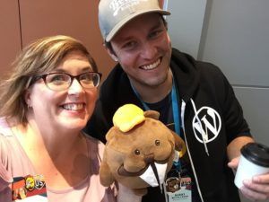 People at WordCamp US with stuffed beavers.