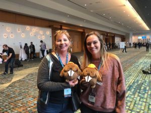 People at WordCamp US with stuffed beavers.